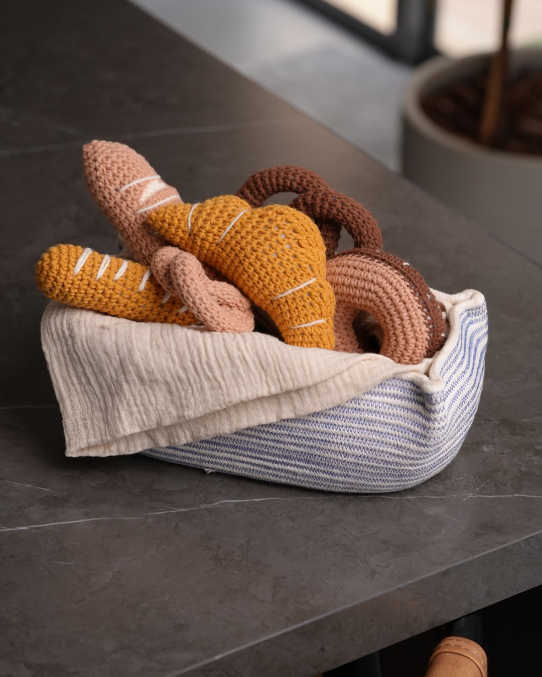Handmade crochet bakery set in a striped basket
